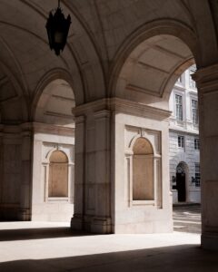 Arches and columns in a sunlit building interior